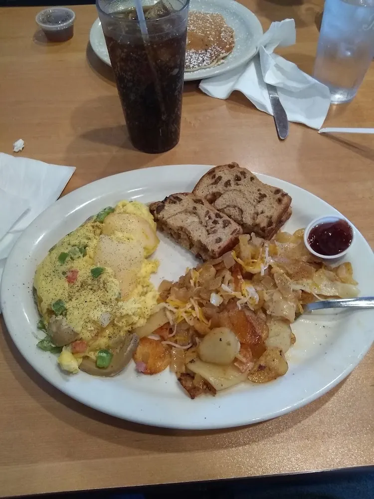 Veggie and Cheese Omelette with Home Fries & Raisen Toast